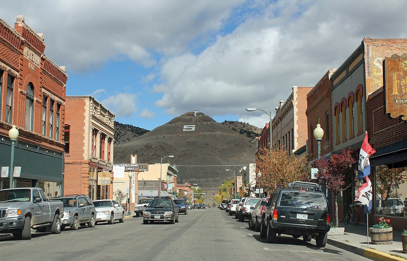 Historic F Street in downtown Salida, Colorado — colorful brick storefronts with Tenderfoot Mountain and its landmark 'S' rising behind