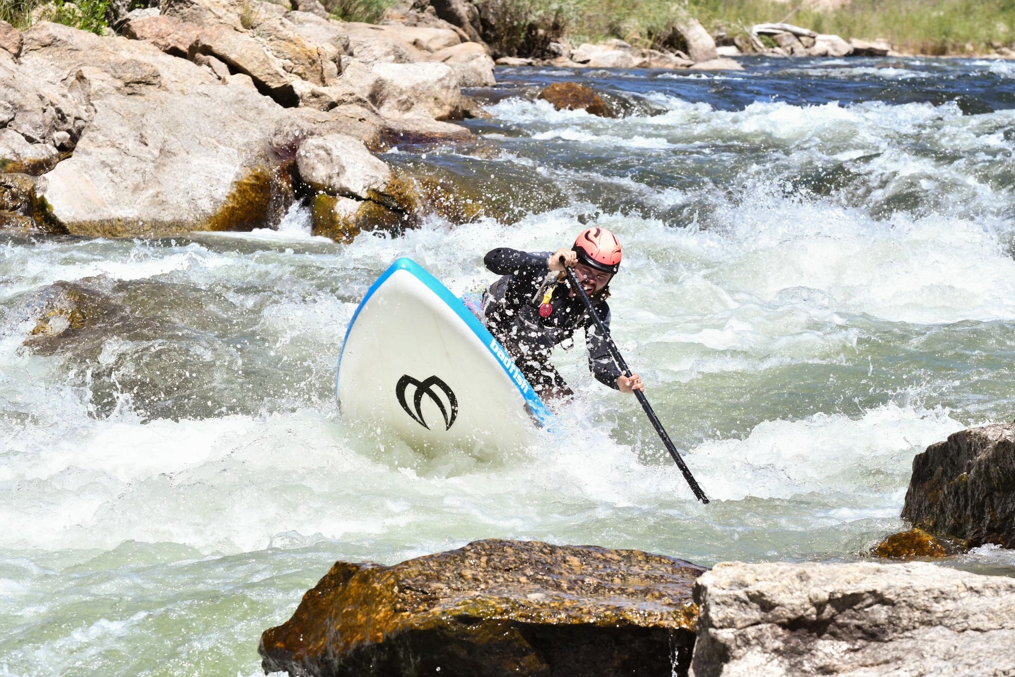 People enjoying outdoor riverside life in the Colorado mountains at golden hour